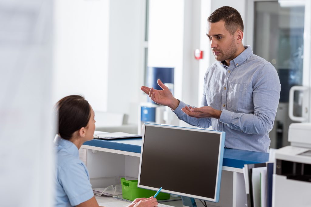 upset patient at front desk